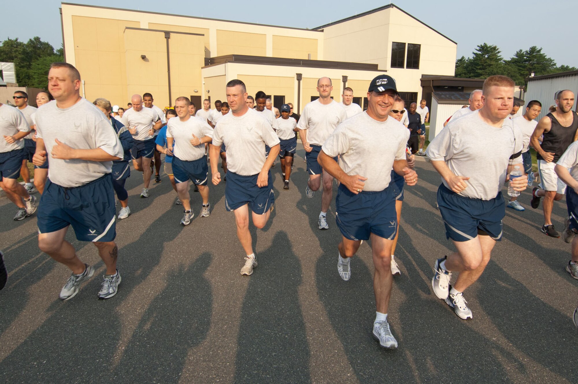 HANSCOM AIR FORCE BASE, Mass. – Runners take off just behind the fitness center July 20 for the Firecracker 5K fun run. Gary Long, from MIT Lincoln Labs, placed first for the men with a run time of 18:40, while Serenity Hultin, from the 66th Force Support Squadron, came in first for the women, running the 5K in 21:50. (U.S. Air Force photo by Rick Berry)