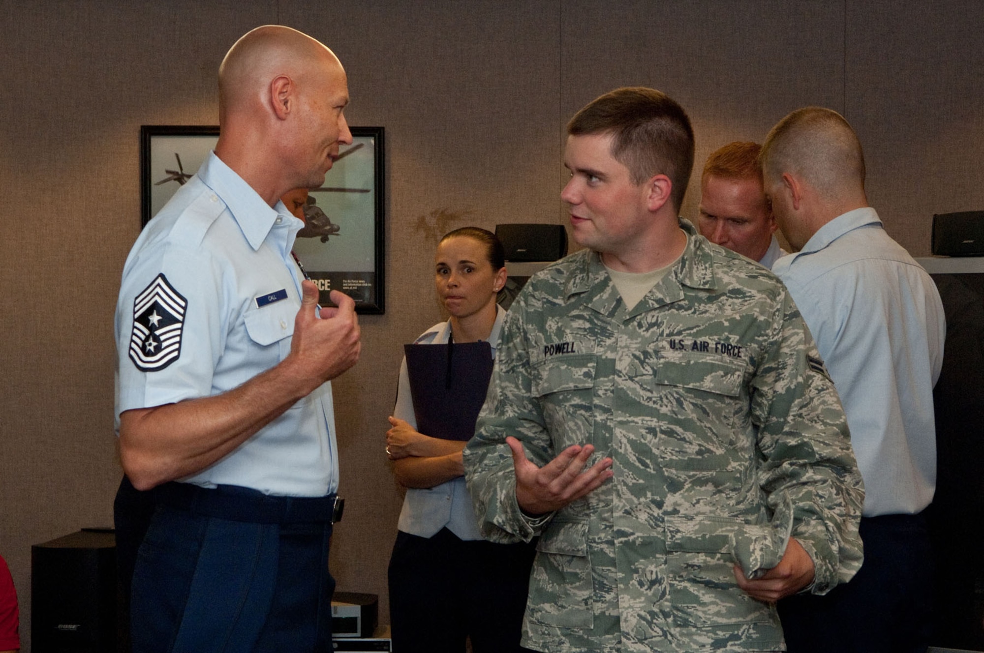 HANSCOM AIR FORCE BASE, Mass. – Chief Master Sgt. Kevin Call, Electronic Systems Center command chief, speaks with Airman 1st Class Benjamin Powell, 66th Medical Squadron, during the dorm dinner July 25. Chief Call’s main focus during his time at ESC will be mentoring and deliberately developing Airmen to lead. (U.S. Air Force photo by Mark Herlihy)