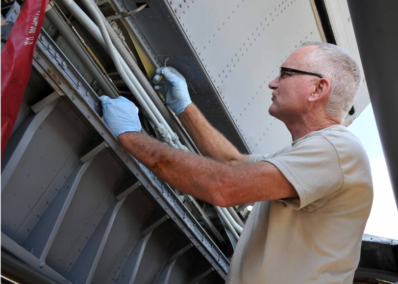 Tech. Sgt. Tommy D. Totherow performs an hourly post-flight inspection on a KC-135 Stratotanker while deployed to Western Europe with the 313th Air Expeditionary Wing on July 28, 2011.
