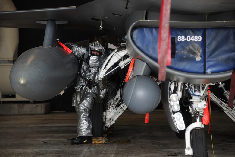 KUNSAN AIR BASE, Republic of Korea -- An 8th Civil Engineer Squadron firefighter responds to an F-16 Fighting Falcon's simulated gas leak during Exercise Beverly Midnight 11-3 here July 27. The purpose of exercises like this is to demonstrate wartime capabilities, while operating in a contingency environment. (U.S. Air Force photo/Staff Sgt. Rasheen Douglas)