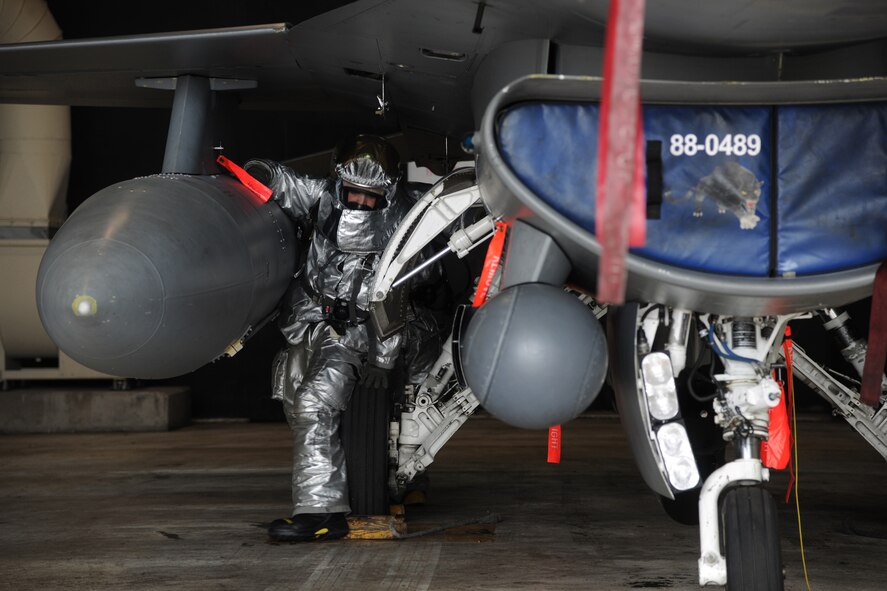 KUNSAN AIR BASE, Republic of Korea -- An 8th Civil Engineer Squadron firefighter responds to a simulated gas leak from an F-16 Fighting Falcon during Exercise Beverly Midnight 11-3 here July 27. The firefighter wears the new version of a Joint Firefighter Integrated Response Ensemble in order to test its fit, fabric and capabilities.  (U.S. Air Force photo/Staff Sgt. Rasheen Douglas) 

