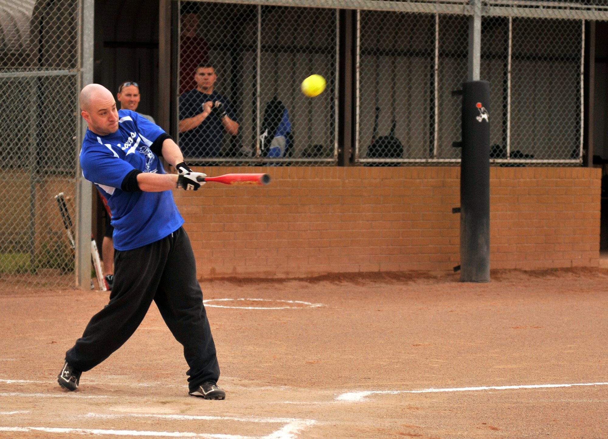 ROYAL AIR FORCE LAKENHEATH, England - Senior Airman Rich Stoddard, 48th Logistics Readiness Squadron fuels controller, hits a softball during the 2011 Base Intramural Softball playoffs against the 48th Security Forces Squadron, July 26, 2011. The 48th SFS defeated the 48th LRS with a score of 13-7. (U.S. Air Force photo/Senior Airman Tiffany M. Deuel)
