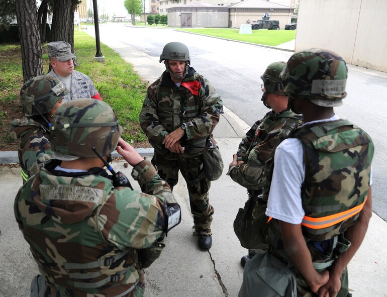 KUNSAN AIR BASE, Republic of Korea -- U.S. Air Force Airman 1st Class James Cline, a member of the 8th Security Forces Squadron, peers intensely around a humvee for invading enemy forces during Exercise Beverly Midnight 11-3 here July 26. Kunsan AB is participating in a base wide operational readiness exercise to evaluate its readiness and its ability to conduct wartime mission.  (U.S. Air Force photo/Staff Sgt. Rasheen Douglas)(Released)