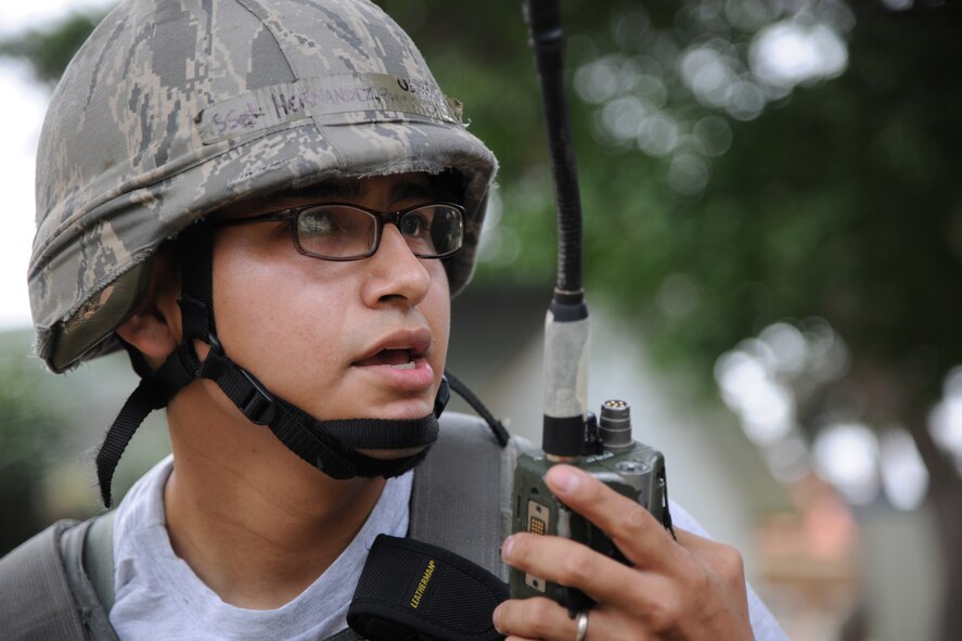 KUNSAN AIR BASE, Republic of Korea -- U.S. Air Force Staff Sgt. Philip Hernandez, a member of the 8th Security Forces Squadron, radios in movement of enemy forces during Exercise Beverly Midnight 11-3 at here July 26. Kunsan AB is participating in a base wide operational readiness exercise to evaluate its readiness and its ability to conduct wartime mission.  (U.S. Air Force photo/Staff Sgt. Rasheen Douglas)(Released)