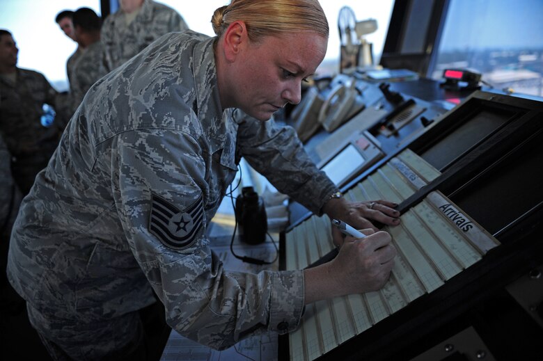 Tech. Sgt. Jennifer Rowles, 39th Operations Squadron tower watch supervisor, updates aircraft arrival information July 27, 2011, at Incirlik Air Base, Turkey. Air traffic controllers here run about 25,000 operations a year. (U.S. Air Force photo by Senior Airman Anthony Sanchelli/Released)