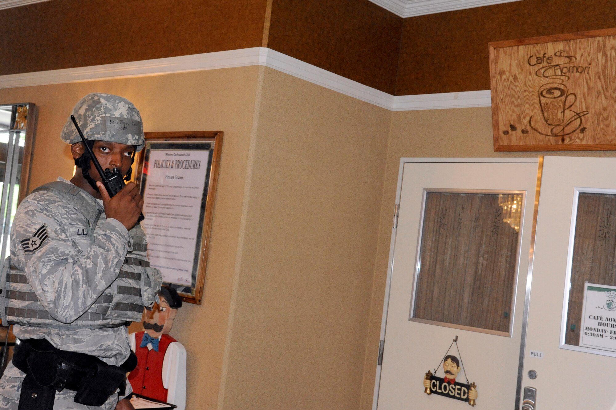 MISAWA AIR BASE, Japan -- Staff Sgt. Jason Lilly, 35th Security Forces Squadron, responds to a simulated robbery at Cafe Aomori during a training exercise July 28. The exercise tested the reactions and response's of both the 35th Force Support Squadron and 35th Security Forces Squadron. (U.S. Air Force photo/Staff Sgt. Marie Brown)
