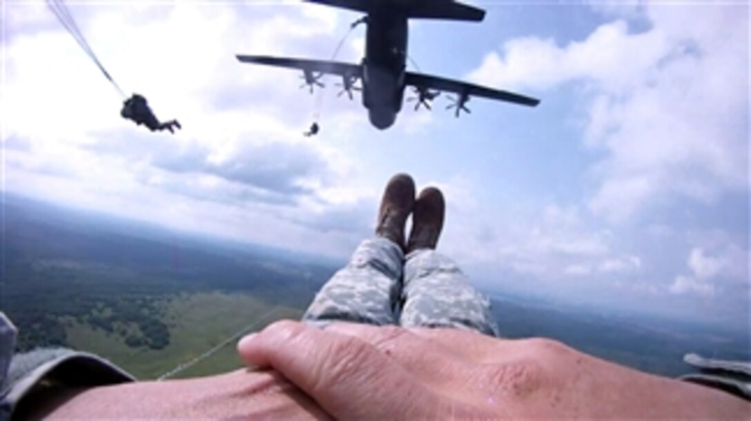 U.S. Army Staff Sgt. Travis Surber, a paratrooper with the 2nd Battalion, 503rd Infantry Regiment of the 173rd Brigade Combat Team parachutes out of a C-130 Hercules aircraft in Ukraine on July 26, 2011.  This event marks the first time soldiers of the 173rd Brigade Combat Team jumped into Ukraine, and while there they trained conducting multinational airborne operations, situational training exercises and field training exercises as part of Rapid Trident 2011.  Rapid Trident is an annual joint combined exercise involving the U.S. and Partnership for Peace member nations.  