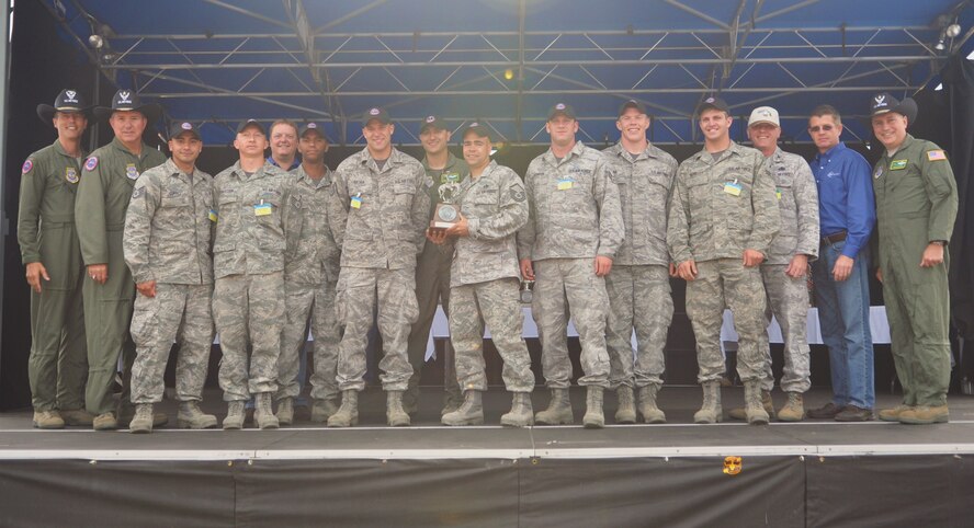 Aerial Port Airmen from the 62nd Airlift Wing and 627th Air Base Group combo team for Air Mobility Rodeo 2011 won the Best In-Transit Visibility team during an awards ceremony at Joint Base Lewis-McChord, Wash., July 29, 2011. Rodeo is a biannual readiness competition that brings Airmen from around the globe to prove and hone their skills in events such as airdrops, aerial refueling, maintenance, security forces and more. (U.S. Air Force photo/Airman 1st Class Leah Young) 