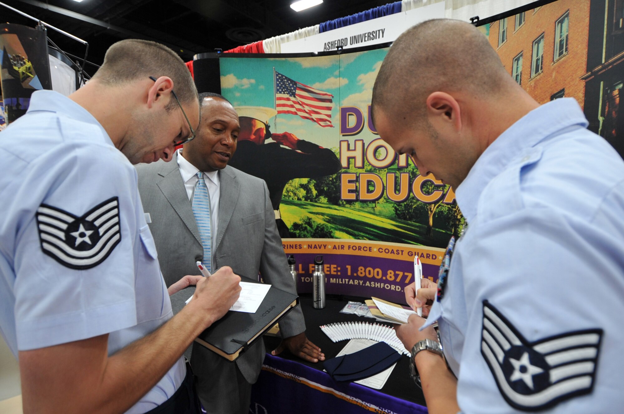 Tech. Sgt. Seth Jones, left, and Staff Sgt. Joshua Leblanc visit one of the information booths during the 50th Anniversary Air Force Sergeants Association Forum in San Antonio on July 25, 2011. The Airmen are Airmen Leadership School instructors from Royal Air Force Lakenheath, England. Airmen and civilians gathered at the five-day forum to discuss Air Force priorities and contributions to national defense. (U.S. Air Force photo/Tech. Sgt. Rey Ramon)