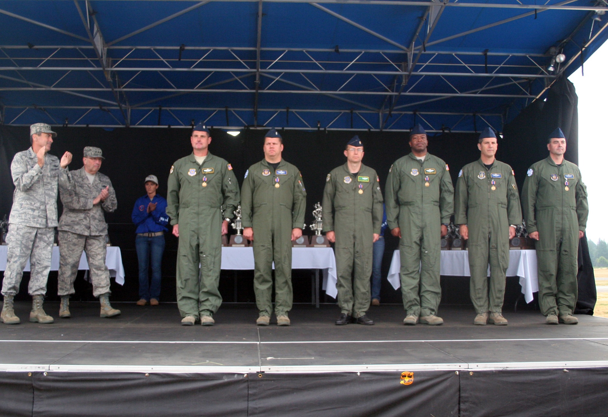 Airmen from the 62nd and 446th Airlift Wings are shown after they were presented with an Air Medal by Gen. Raymond E. Johns Jr., Air Mobility Command commander, July 29, 2011, at Joint Base Lewis-McChord, Wash. Six of seven aircrew members from the aircrew were present to recieve the medal. They are the aircrew from McChord Field who flew a C-17 Globemaster III from Joint Base Lewis-McChord to McMurdo Station, Antarctica, to aeromedically evacuate an ailing government worker from the station from June 28 to 30, 2011. (U.S. Air Force Photo/Master Sgt. Scott T. Sturkol)