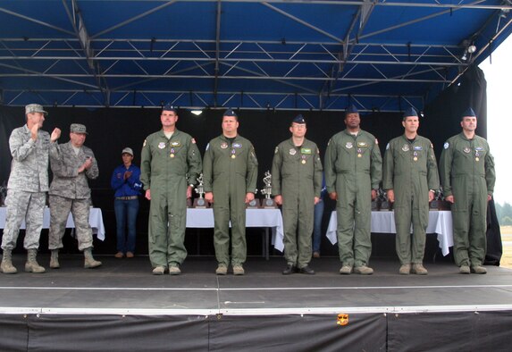 Airmen from the 62nd and 446th Airlift Wings are shown after they were presented with an Air Medal by Gen. Raymond E. Johns Jr., Air Mobility Command commander, July 29, 2011, at Joint Base Lewis-McChord, Washington. Six of seven aircrew members from the aircrew were present to recieve the medal. They are the aircrew from McChord Field who flew a C-17 Globemaster III from Joint Base Lewis-McChord to McMurdo Station, Antarctica, to aeromedically evacuate an ailing government worker from the station from June 28 to 30, 2011. (U.S. Air Force Photo/Master Sgt. Scott T. Sturkol) 

