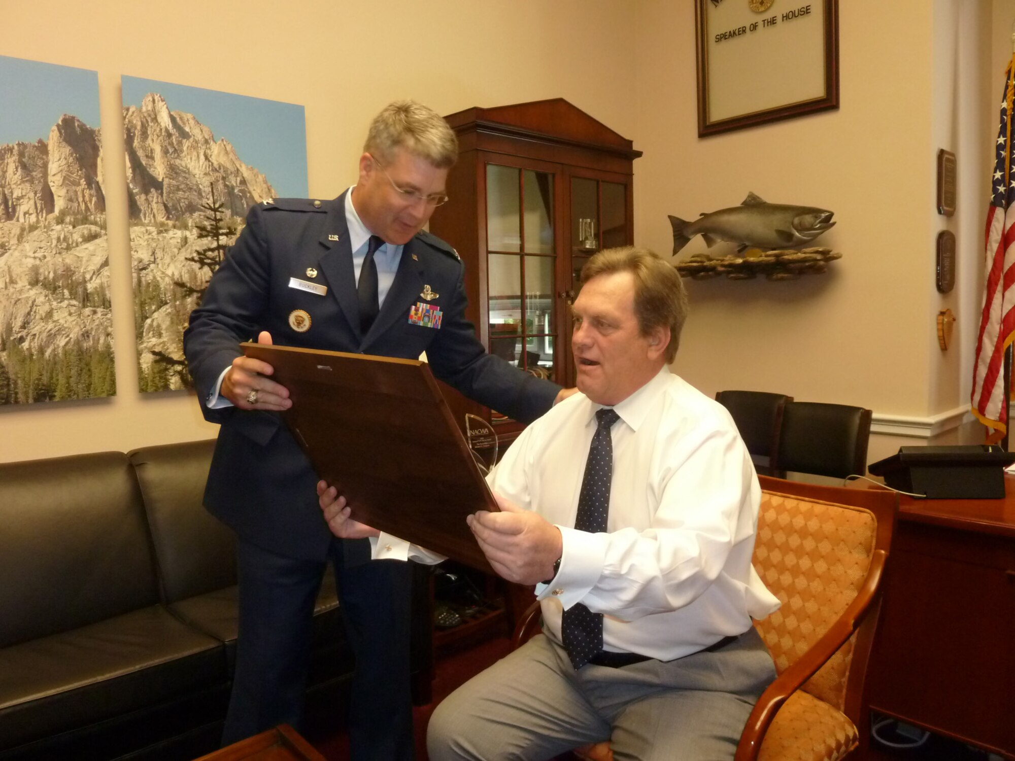 WASHINGTON, D.C. – Col. Ron Buckley, 366th Fighter Wing commander, presents Idaho Congressman Mike Simpson with a token of his appreciation July 14. Colonel Buckley and other leaders from Mountain Home Air Force Base visited Capitol Hill to discuss congressional matters pertaining to MHAFB. (Courtesy photo)