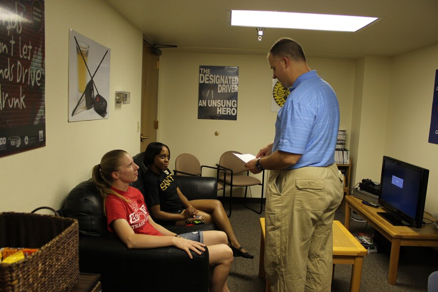 Master Sgt. Charles Small III gives the driver and escort, left, Staff Sgt. Amanda Colyer and Senior Airman Jessica Richards-Elliott, their next pick-up location.

Photo by Master Sgt. Candace Stacy
