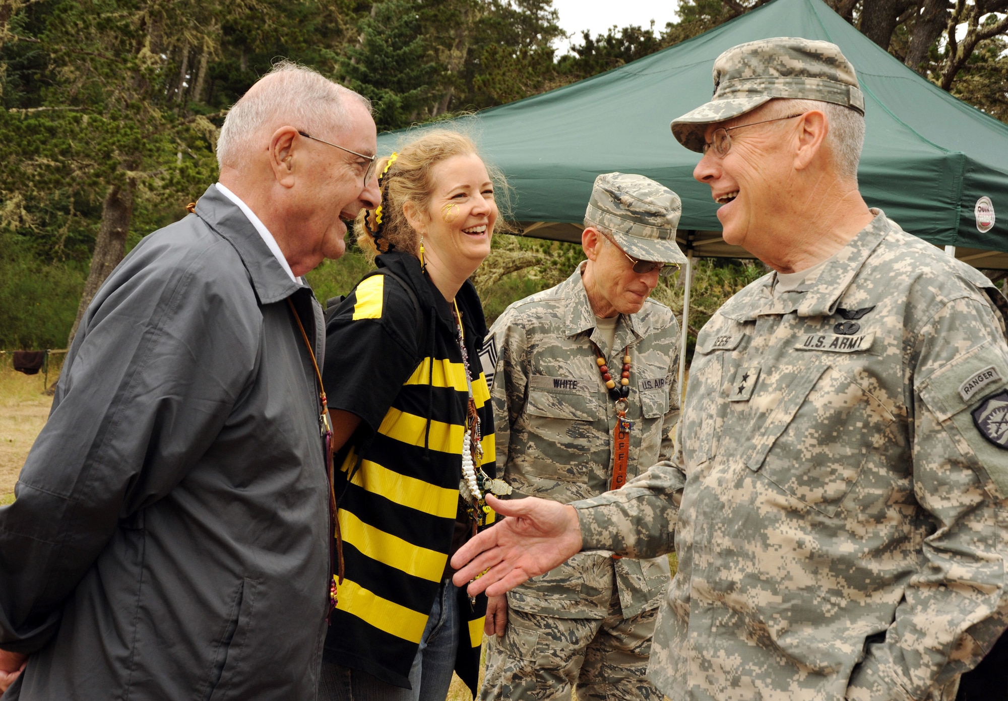 Former Oregon Governor Victor Atiyeh (far left), shares a story about the history of Camp Rosenbaum with (left to right) Leslie Crehan from the Portland Housing Authority, Chief Master Sgt. Max White, 142nd Fighter Wing, and Major General Raymond F. Rees, Adjutant General for the State of Oregon on V.I.G. day at Camp Rosenbaum, held at Camp Rilea, Ore., on July 27, 2011. Governor Atiyeh was one of many ‘Very Important Guest’ to visit the youth camp held each summer for the past 41 years. (U.S. Air Force photograph by Tech. Sgt. John Hughel, 142nd Fighter Wing Public Affairs) (Released)