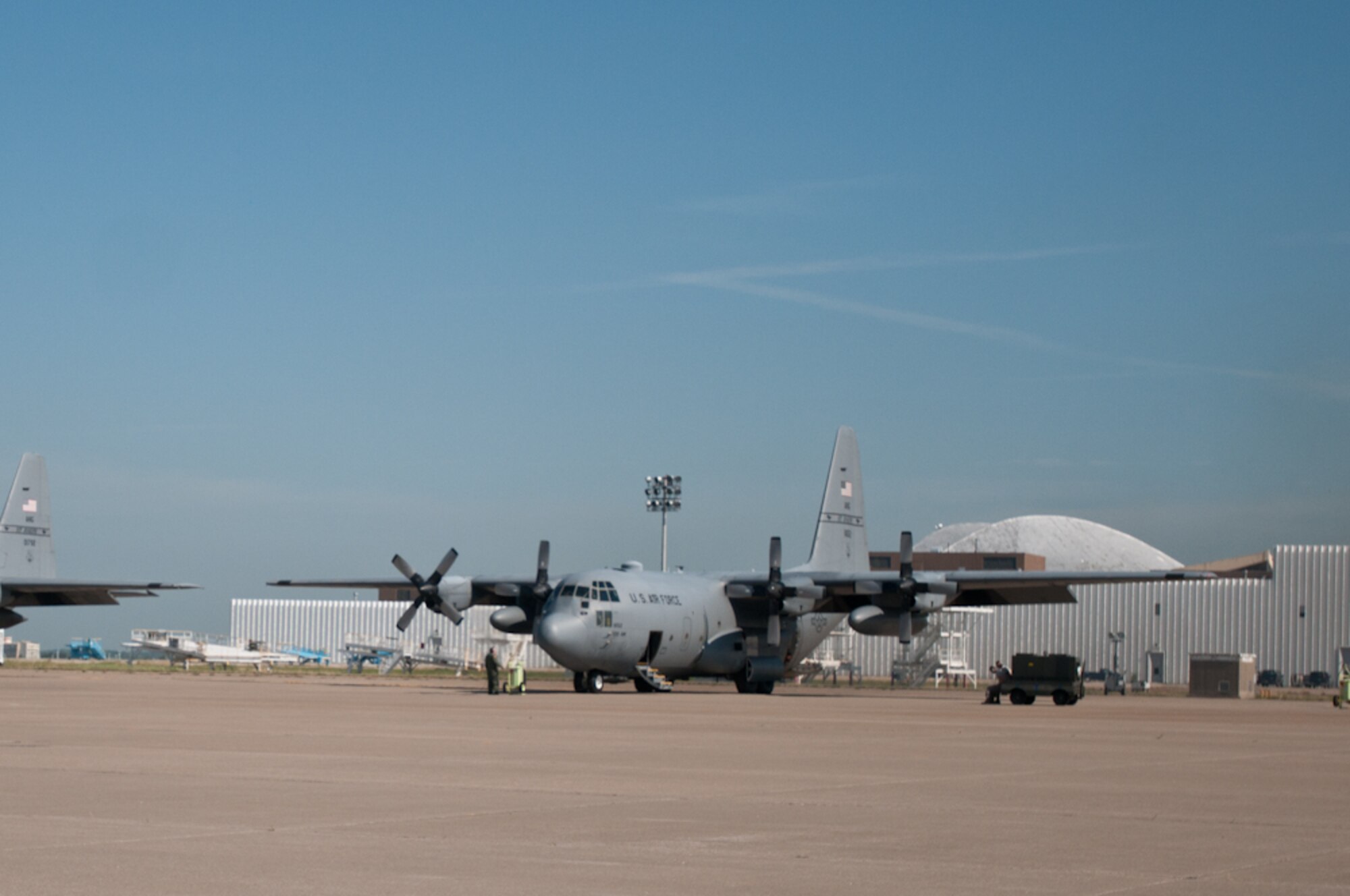 C-130s are prepped and ready for flight by members of the 139th Airlift Wing, Missouri Air National Guard, at the Kansas City International Airport in Kansas City, Mo., July 26, 2011. (U.S. Air Force photo by Senior Airman Katie Kidd)