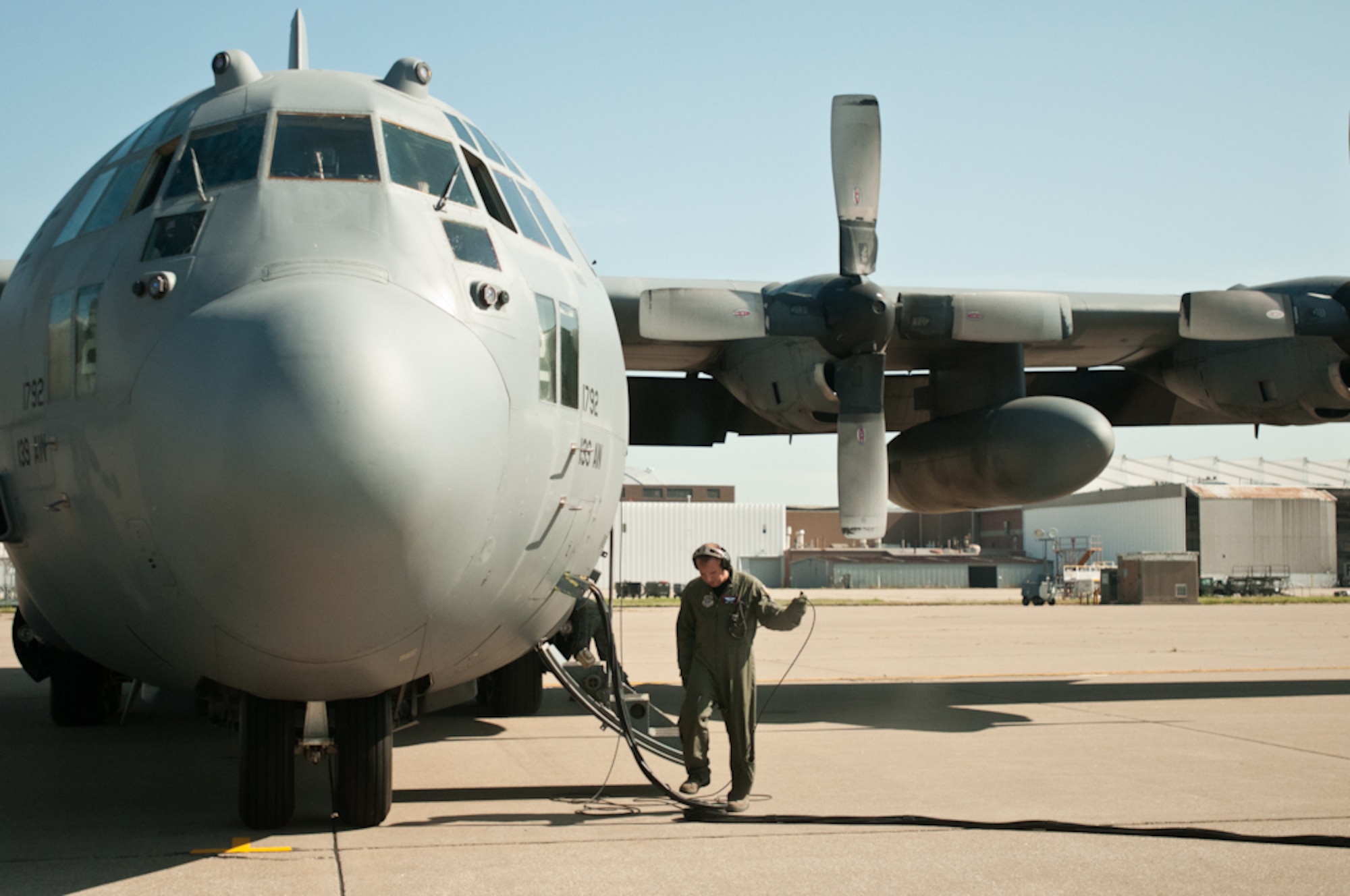 A flight crew member of the 139th Airlift Wing, Missouri Air National Guard, readies a C-130 for flight at the Kansas City International Airport in Kansas City, Mo., July 26, 2011. (U.S. Air Force photo by Senior Airman Katie Kidd)
