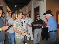 Foreign students from the Defense Language Institute English Language Center tour the Bob Bullock Texas State History Museum in Austin. Volunteer Weston Reese, a docent with the museum, guided the group during the visit.