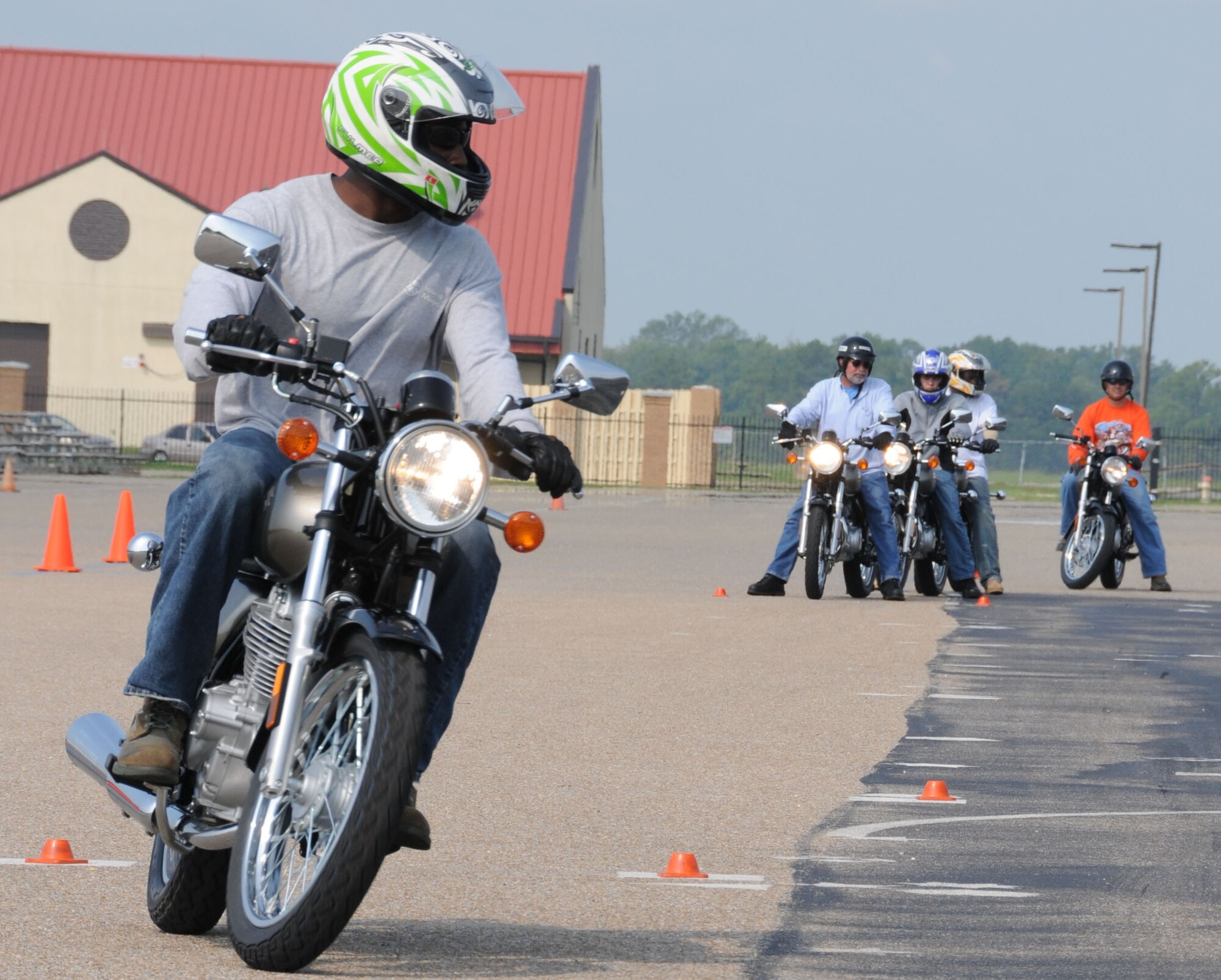 Second Lt. Kevin Rivers of the Air Force Program Executive Office maneuvers through the obstacles and tests his skills at a motorcycle safety course July 21. Air Force officials have declared 2011 the year of motorcycle safety. (Air Force photo/Chris Baldwin)