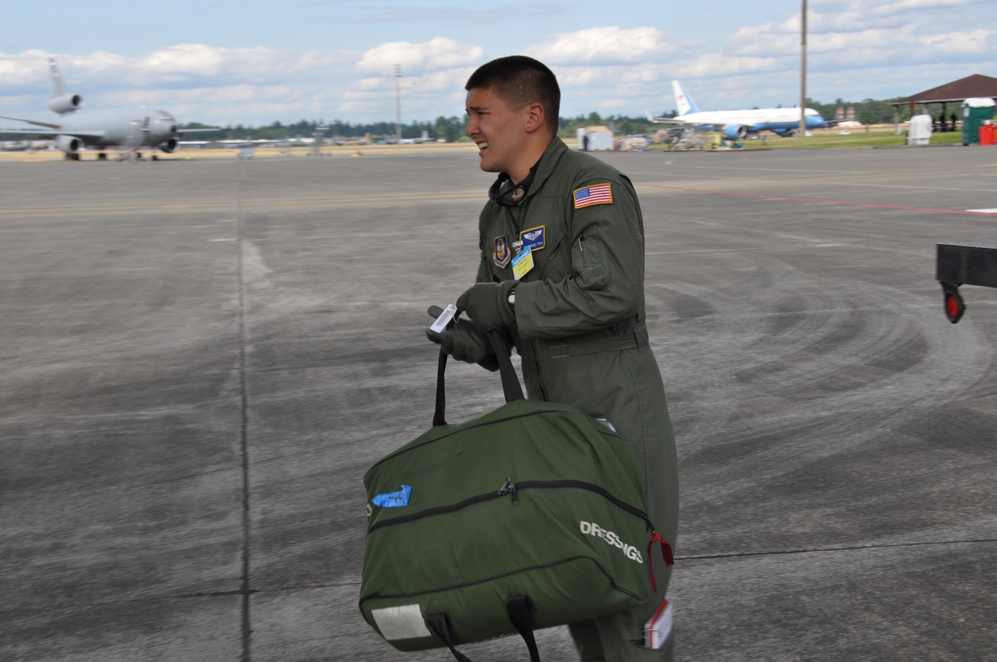 A member of Joint Base Lewis-McChord's Aeromedical Evacuation team preloads medical equipment aboard an aircraft before the flight during an AE competition during the Air Mobility Rodeo 2011 July 27, 2011. (U.S. Air Force photo/Airman 1st Class Michael Battles)