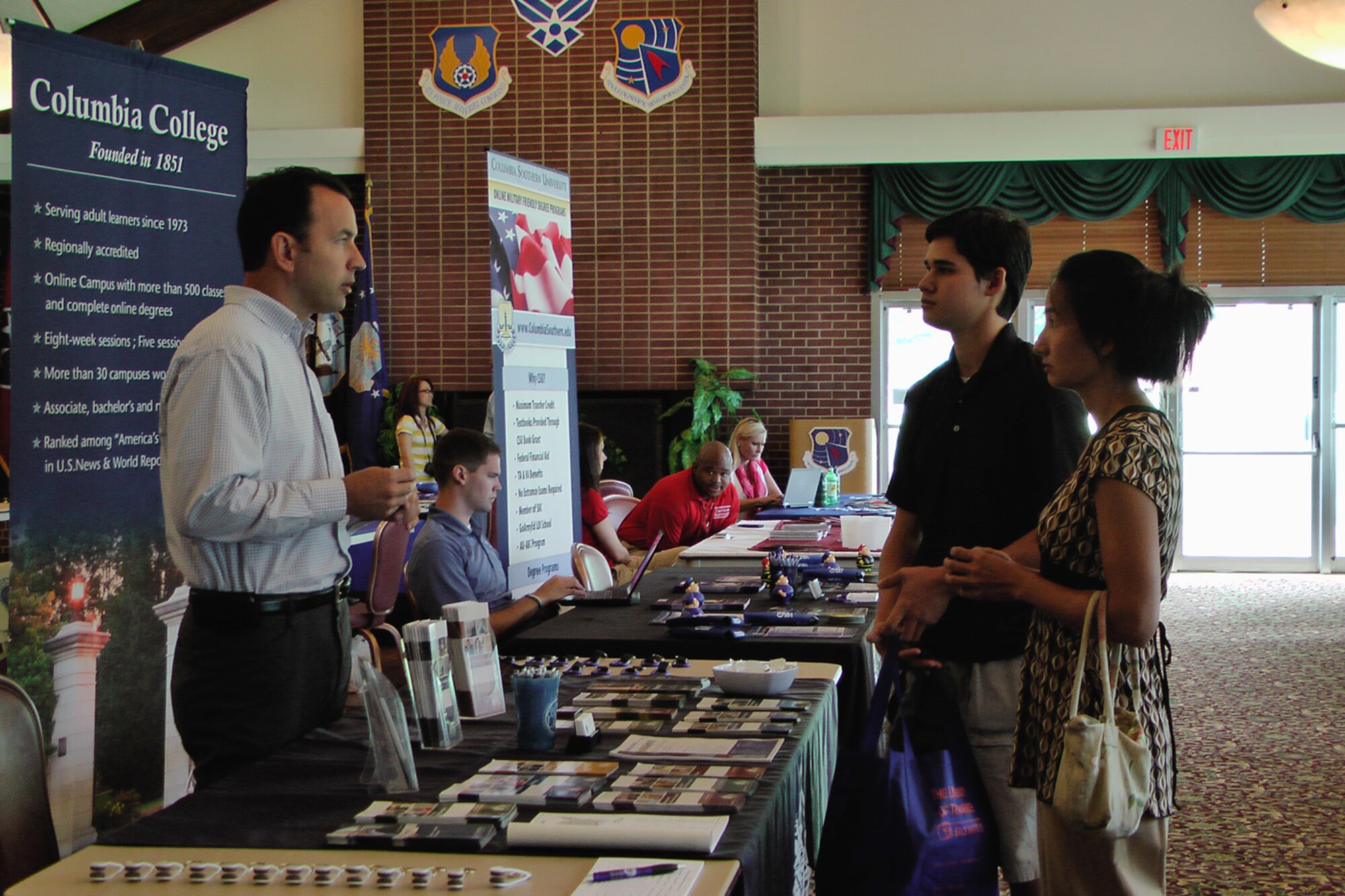 James Tucker and his mother, Jennifer, check out the degree programs from Columbia College, one of 29 higher education institutions signed up for the AEDC education fair. Tucker is a junior at Coffee County Central High School in Manchester. (Photo by Patrick Ary)