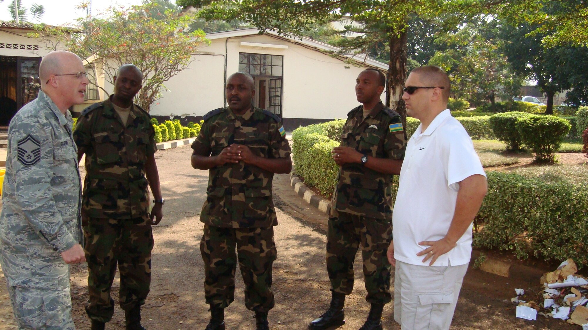 (Far right) Master Sgt. Robert Haner, 65th Operations Support Squadron, discusses airfield response and management with three Rwandan servicemembers during his deployment to Rwanda for a 10-day temporary duty assignment.  Haner deployed from Lajes Field, Azores, to the eastern African nation July 9.  (Courtesy photo)
