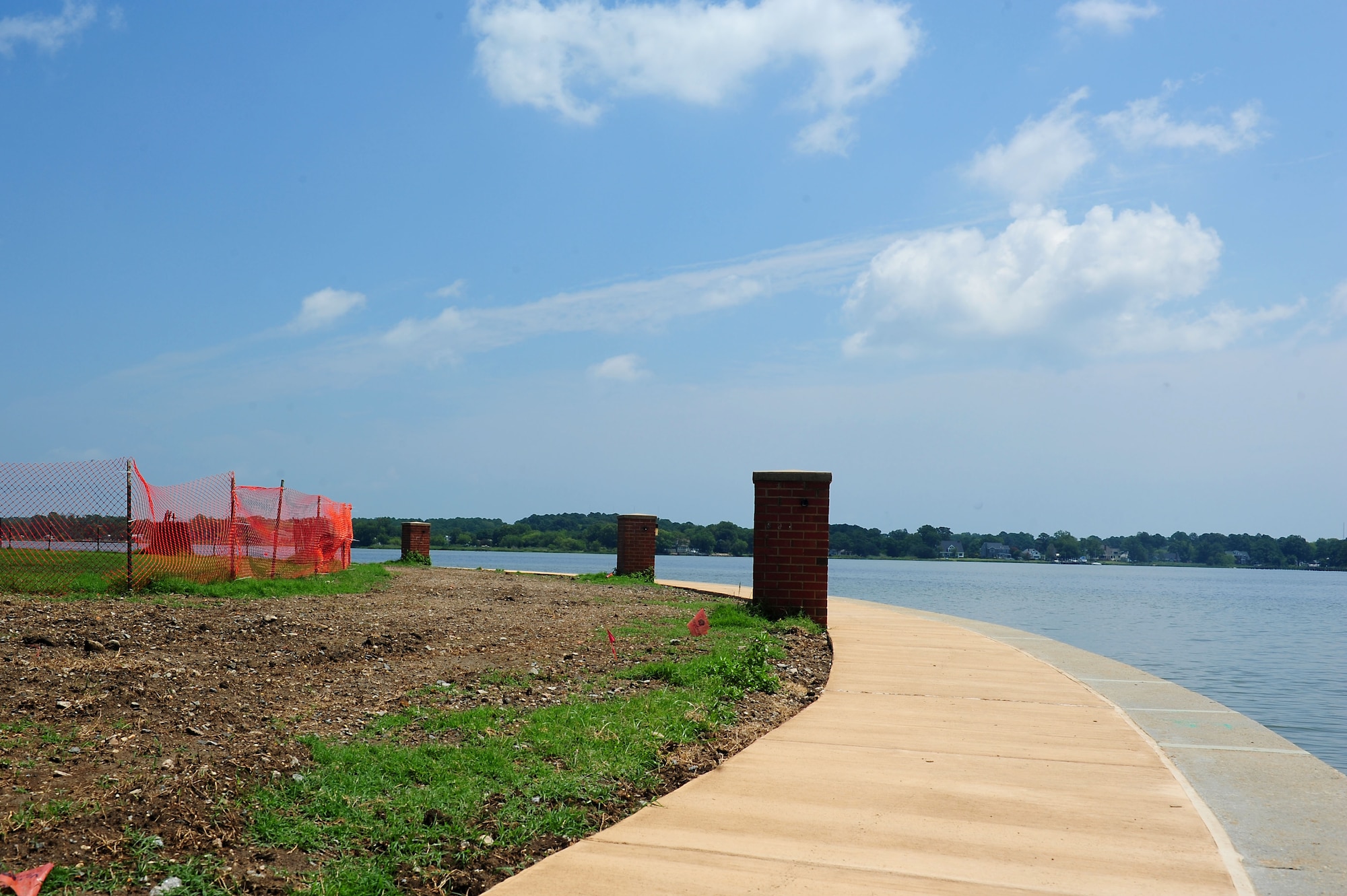 A new sidewalk is built as part of a shoreline restoration project at Langley Air Force Base, Va., July 27, 2011. The estimated completion date for the restoration project is January 2012. (U.S. Air Force photo by Airman 1st Class Kayla Newman/Released)