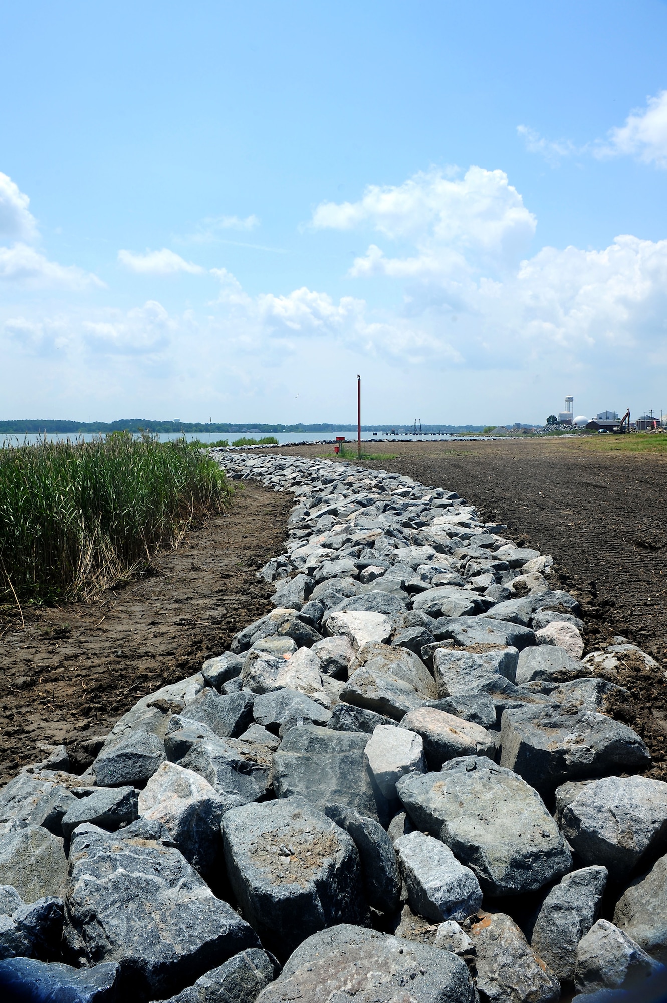The granite rocks line the shoreline as part of a restoration project at Langley Air Force Base, Va., July 27, 2011.  Part of the restorations will include a living shoreline with big cordgrass and salt meadow hay to help prevent erosion. (U.S. Air Force photo by Airman 1st Class Kayla Newman/Released)