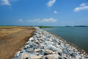 The granite rocks line the shoreline as part of a restoration project at Langley Air Force Base, Va., July 27, 2011. The 330 million year-old rocks are placed along Langley’s vulnerable waterside perimeter to strengthen and protect the shoreline around the base. (U.S. Air Force photo by Airman 1st Class Kayla Newman/Released)