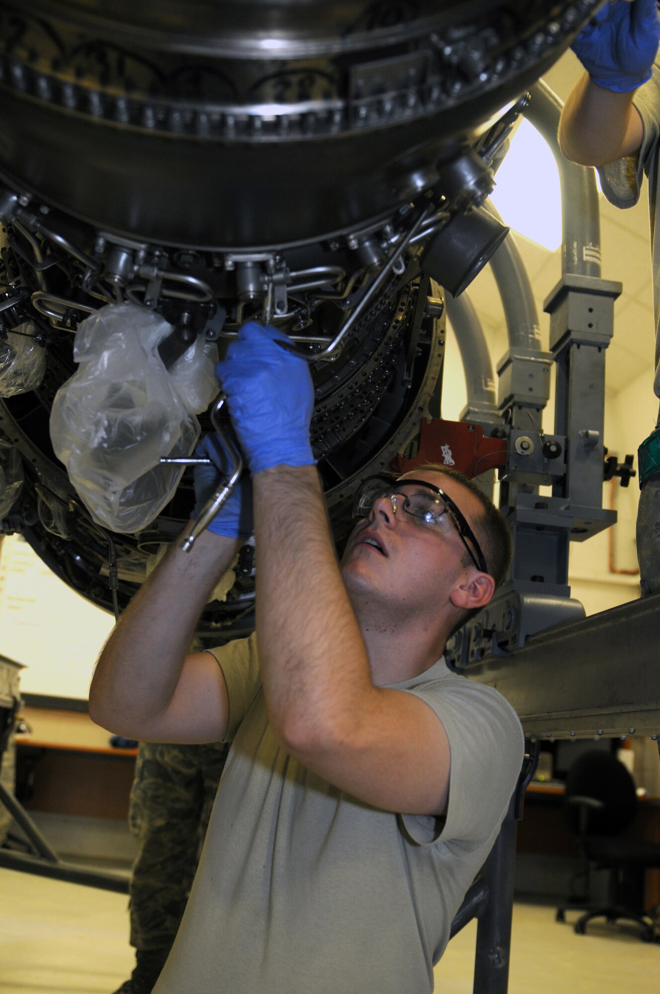 ROYAL AIR FORCE LAKENHEATH, England - Senior Airman Christopher Conley, 48th Component Maintenance Squadron aerospace propulsion journeyman, practice repairs on an aircraft engine during a class held by the 372nd Squadron Training Detachment 16, at RAF Lakenheath, July 27, 2011. Detachment 16 offers more than 55 different courses to ensure all 48th Fighter Wing maintainers are qualified to repair and inspect assigned aircraft supporting the Liberty Wing mission of worldwide responsive combat air power and support. (U.S. Air Force photo/Airman Cory Payne)
