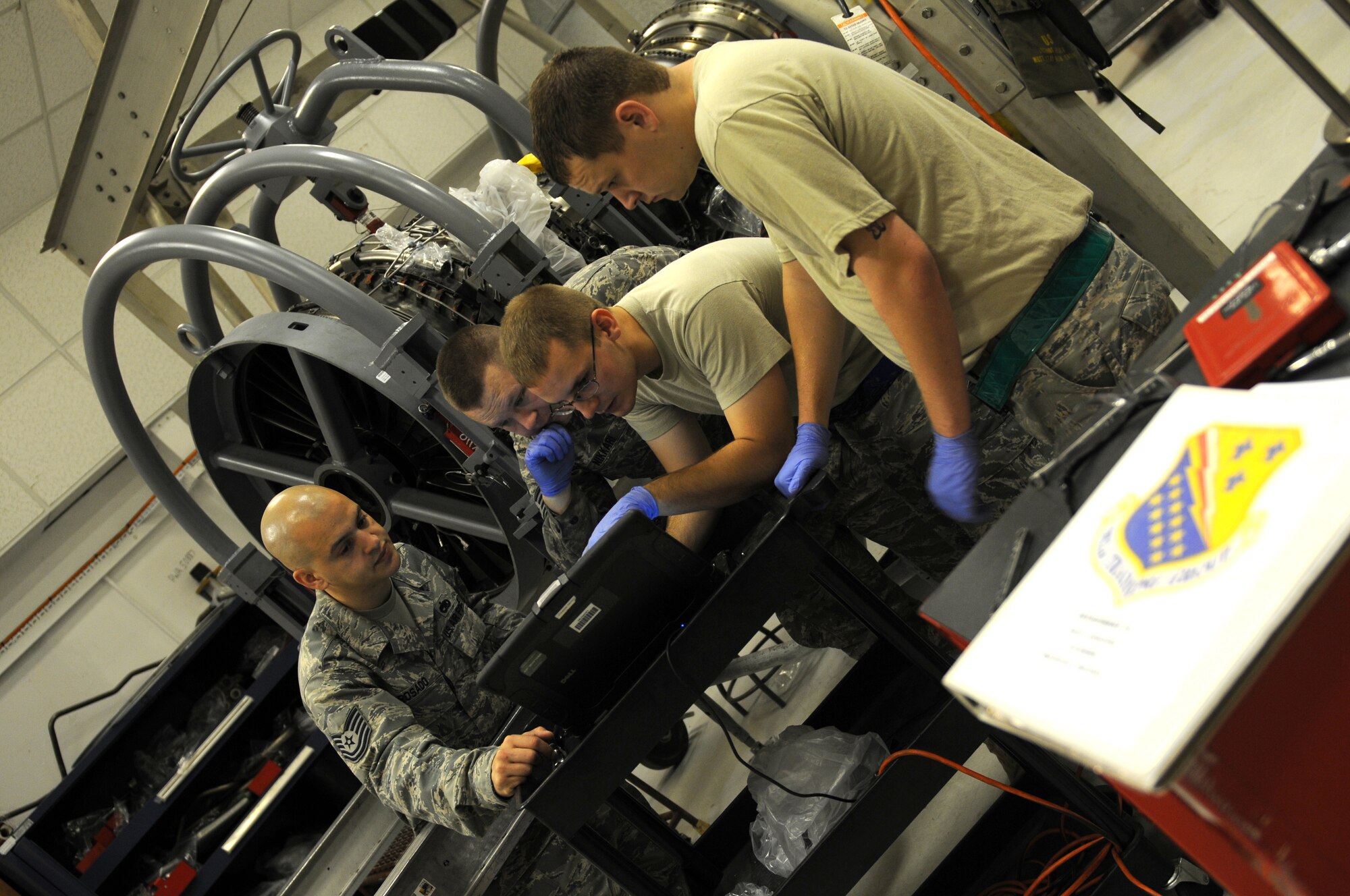 ROYAL AIR FORCE LAKENHEATH, England - Tech. Sgt. Algelis Rosado, 372nd Squadron Training Detachment 16 propulsion instructor, teaches a class to 48th Component Maintenance Squadron Airmen on aircraft engine repairs at RAF Lakenheath, July 27, 2011. Detachment 16 offers more than 55 different courses to ensure all 48th Fighter Wing maintainers are qualified to repair and inspect assigned aircraft supporting the Liberty Wing mission of worldwide responsive combat air power and support. (U.S. Air Force photo/Airman Cory Payne)