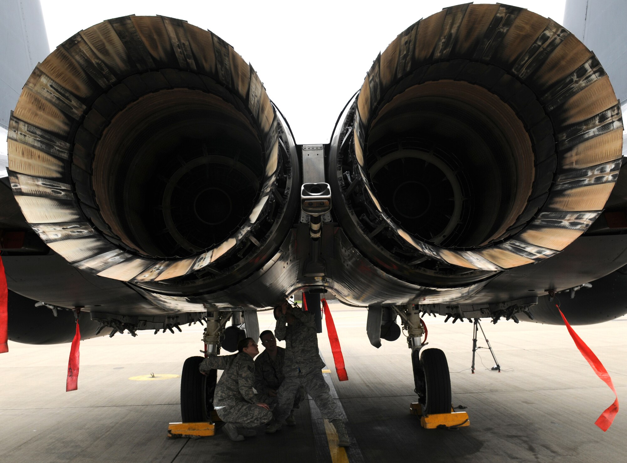 ROYAL AIR FORCE LAKENHEATH, England - Staff Sgt. Andrea Martin (left), 48th Equipment Maintenance Squadron inspection craftsman, Tech Sgt. Scott Douglass, 372nd Squadron Training Detachment 16 crew chief instructor, and Staff Sgt. John Phillippo, 492nd Aircraft Maintenance Unit crew chief, practice preflight checks on an F-15E Strike Eagle at RAF Lakenheath, July 27, 2011. Detachment 16 offers more than 55 different courses to ensure all 48th Fighter Wing maintainers are qualified to repair and inspect assigned aircraft supporting the Liberty Wing mission of worldwide responsive combat air power and support. (U.S. Air Force photo/Airman Cory Payne)