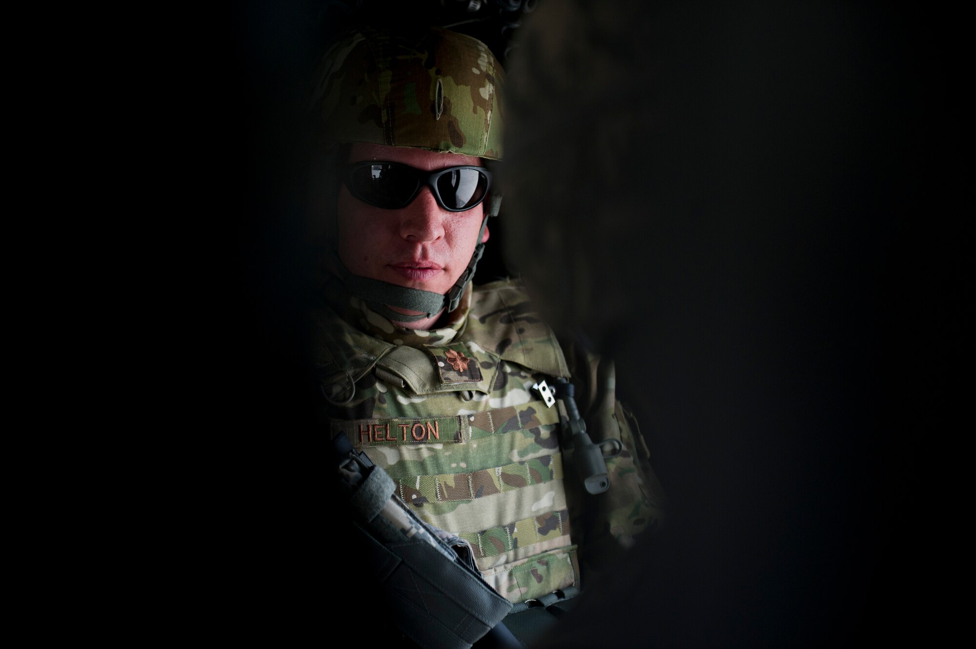 U.S. Air Force Maj, Jason Helton, air mobility liaison officer (AMLO), Ft. Lewis, WA. is ready to take off on his helicopter flight to a remote Afghanistan border police (ABP) outpost in southern Afghanistan. Helton is going to the outpost to survey an area that aircrews can use as a drop zone to resupply ground forces. Helton also trains the U.S. Army, 3rd Zone, ABP security forces advisement team on drop zone establishment procedures. (U.S. Air Force Photo/Master Sgt. Jeffrey Allen)