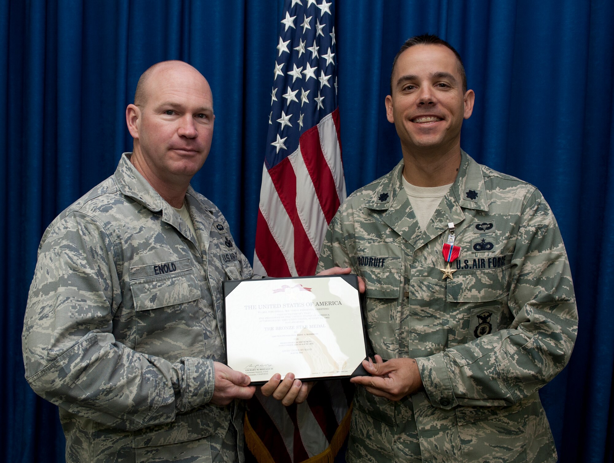 Lt. Col. Brint Woodruff, 39th Security Forces Squadron commander, is presented the Bronze Star Medal by Col. Scott Enold, 39th Mission Support Group commander, in the 39th MSG conference room July 28, 2011, at Incirlik Air Base, Turkey. Woodruff received the Bronze Star Medal for his actions while deployed as the 532nd Expeditionary Security Forces Squadron commander at Joint Base Balad, Iraq. (U.S. Air Force photo by Airman 1st Class Clayton Lenhardt/Released)