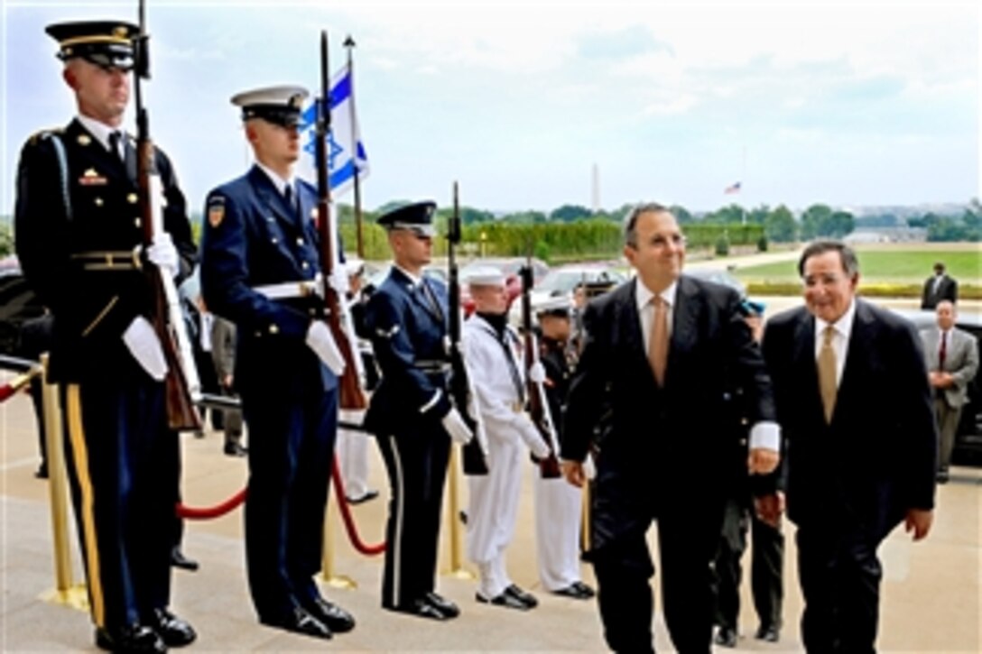 Secretary of Defense Leon E. Panetta (right) escorts Israeli Defense Minister Ehud Barak through an honor cordon and into the Pentagon on July 28, 2011.  Panetta and Barak will hold security talks on a range of issues.  