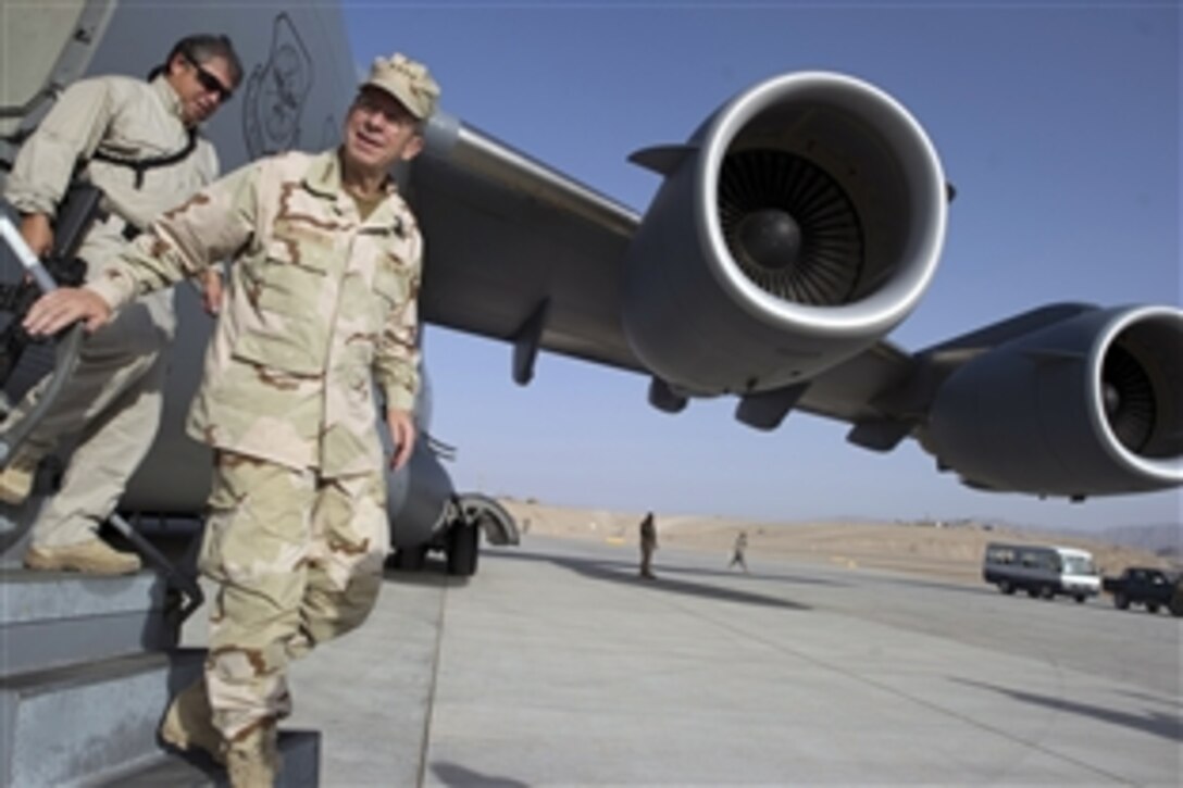 Navy Adm. Mike Mullen, chairman of the Joint Chiefs of Staff, arrives at Bagram Air Base in Afghanistan, July 30, 2011. Mullen is on a five-day tour in Afghanistan and Iraq with USO celebrities, including comedian Jon Stewart, NBA Legend Karl Malone and magician David Blane.