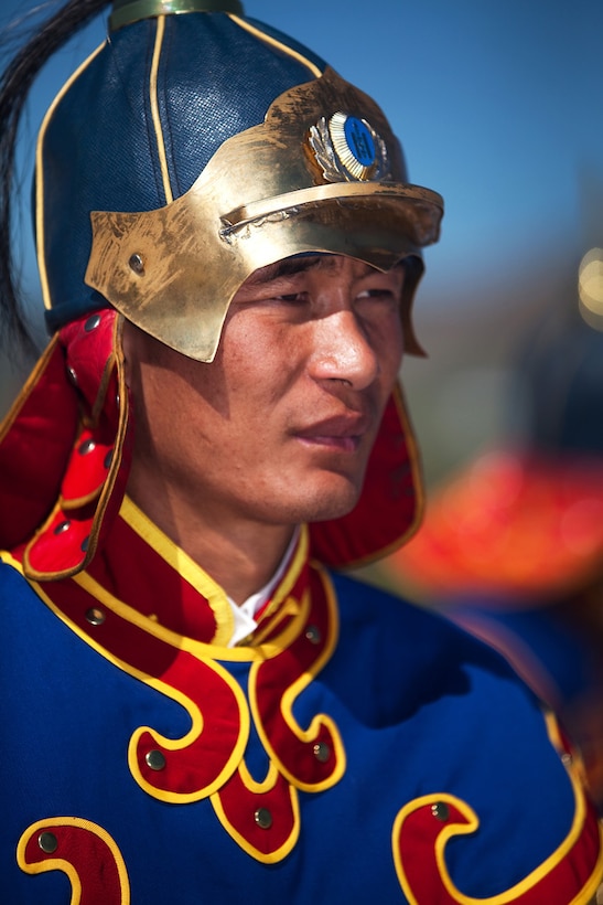 A Mongolian state honor guard member stands at attention while being addressed by Mongolian President Ts. Eldegdorj during the opening ceremony of Exercise Khaan Quest 2011 at Five Hills Training Area, Ulaanbaatar, Mongolia, July 31. Khaan Quest is a training exercise designed to strengthen the capabilities of U.S., Mongolian and other nations' forces in international peace support operations worldwide.