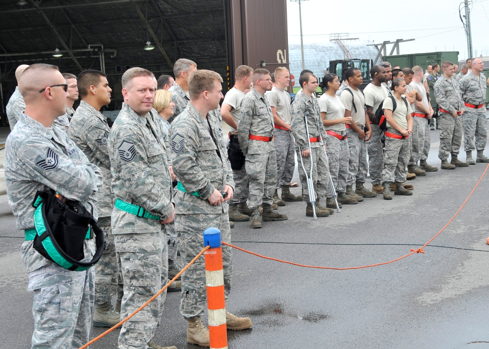 Members of team Osan gather during the 51 Fighter Wing load crew competition July. 22. The competition consisted of 3 teams from the 25th, 36th and the 354th Aircraft Maintenance Unit from Davis-Monthan Air Force Base. (U.S. Air Force Photos by/ Senior Airman Adam Grant)