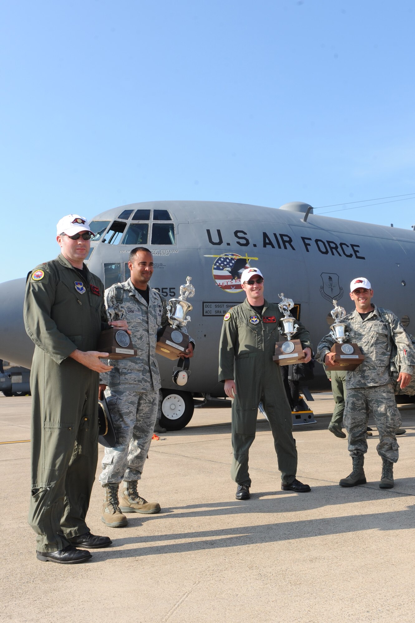 (Left to right) Maj. John Fay, a 314th Operations Group navigator; Capt. Jason Lugo, 314th Aircraft Maintenance Squadron aircraft maintenance unit officer-in-charge; Maj. J.P. Kilker, 314th Airlift Wing Legacy C-130 team chief, and Master Sgt. Jonathan Merced, 314th Airlift Wing C-130E maintenance NCO-in-charge, hold trophies July 30, 2011, at Little Rock Air Force Base, Ark.  The Airmen hold four of six trophies the team won during the Air Mobility RODEO 2011 held at McChord Field at Joint Base Lewis-McChord, Wash., from July 24 - 29. (U.S. Air Force photo by Tech. Sgt. Chad Chisholm)
