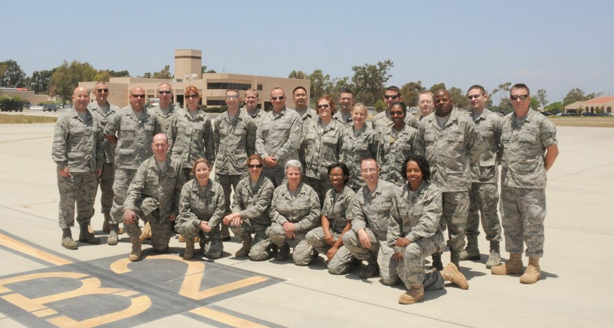 The 531nd Air National Guard Band of the Gulf Coast from NAS Fort Worth JRB pose for a group photo after landing at Channel Island Air National Guard Station, California, July 8, 2011. The band prepares to join the Air National Guard Band of the Southwest for their 2011 tour in Camarillo, Woodland Hills, Anaheim, West Minster, and Redondo Beach. (U.S. Air Force photo by Master Sgt. Dave Buttner)