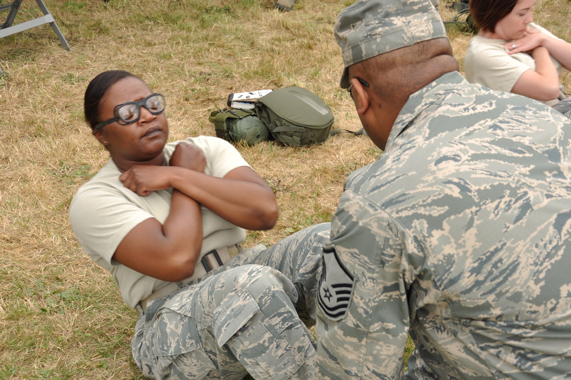 Tech. Sgt. Adrienne Johnson, 92nd Comptroller Squadron and Fairchild Rodeo team member, does a minute of sit-up at the beginning of the financial management challenge course July 26 at Joint Base Lewis-McChord, Wash., as part of the Air Mobility Rodeo 2011. This was the first year the finance community joined the ranks of Rodeo. (U.S. Air Force Photo/Tech. Sgt. Jennifer Buzanowski)
