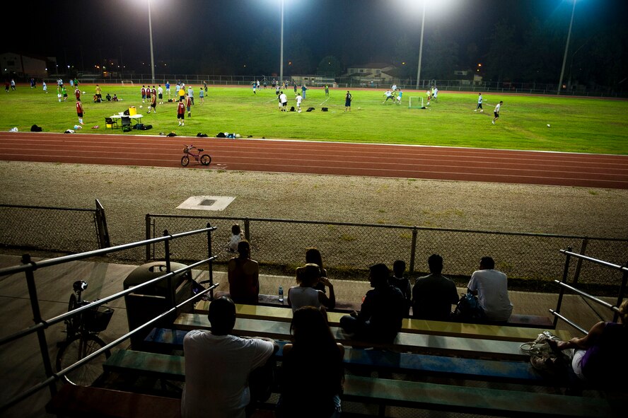 Turkish and U.S. Air Force teams and spectators gather for the Late Night Soccer tournament at the high school soccer field July 29, 2011, at Incirlik Air Base, Turkey. Eleven teams competed in the double-elimination tournament. (U.S. Air Force photo by Tech. Sgt. Michael B. Keller/Released)