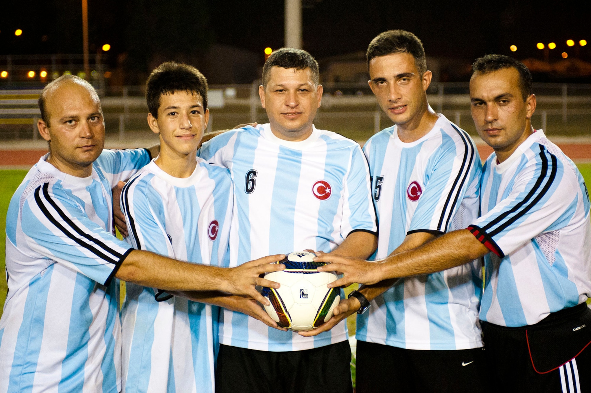 The Turkish air force Security One team pose for a photograph after winning the Late Night Soccer Tournament at the high school soccer field July 29, 2011, at Incirlik Air Base, Turkey. The team members from left to right are Deniz Kayhan, Batuhen Belge, Erol Belge, Ender Cemrek, and Bulent Arca. (U.S. Air Force photo by Master Sgt. James Law/Released)