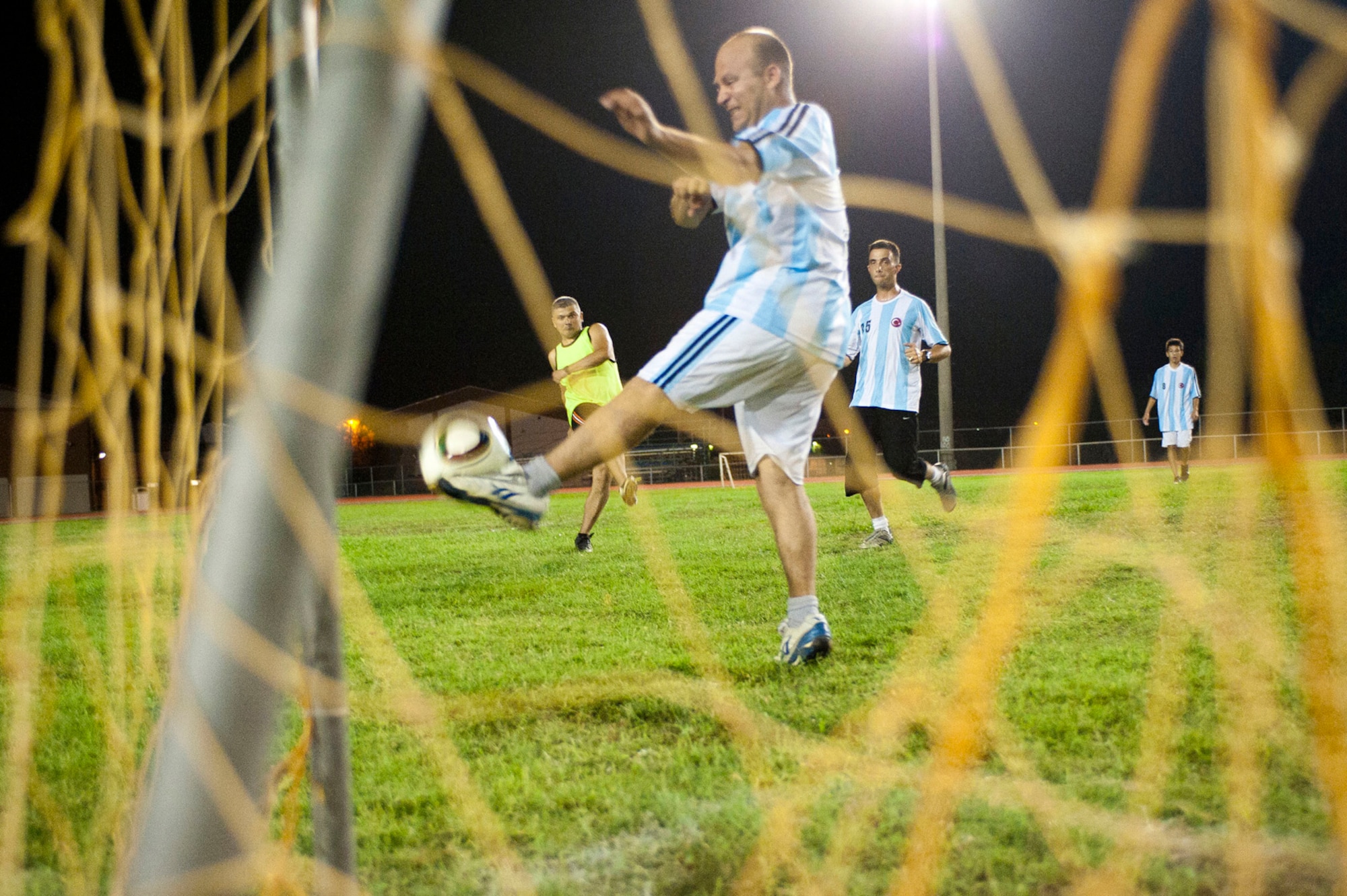 Turkish air force teams Security One and Turkish Stars face off in the Late Night Soccer tournament at the high school soccer field July 29, 2011, at Incirlik Air Base, Turkey. Security One defeated the Turkish Stars in the double-elimination tournament. (U.S. Air Force photo by Master Sgt. James Law/Released)