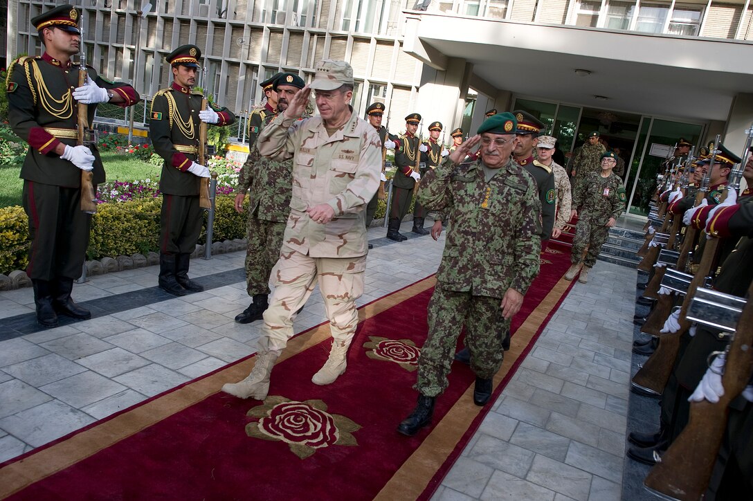 U.S. Navy Adm. Mike Mullen, chairman of the Joint Chiefs of Staff, and Lt. Gen. Sher Mohammad Karimi, chief of the General Staff of the Afghan National Army, depart the Ministry of Defense in Kabul, Afghanistan, July 31, 2011. Mullen is on a five-day USO tour with comedian Jon Stewart, NBA legend Karl Malone and magician David Blaine visiting troops in Afghanistan and Iraq. 