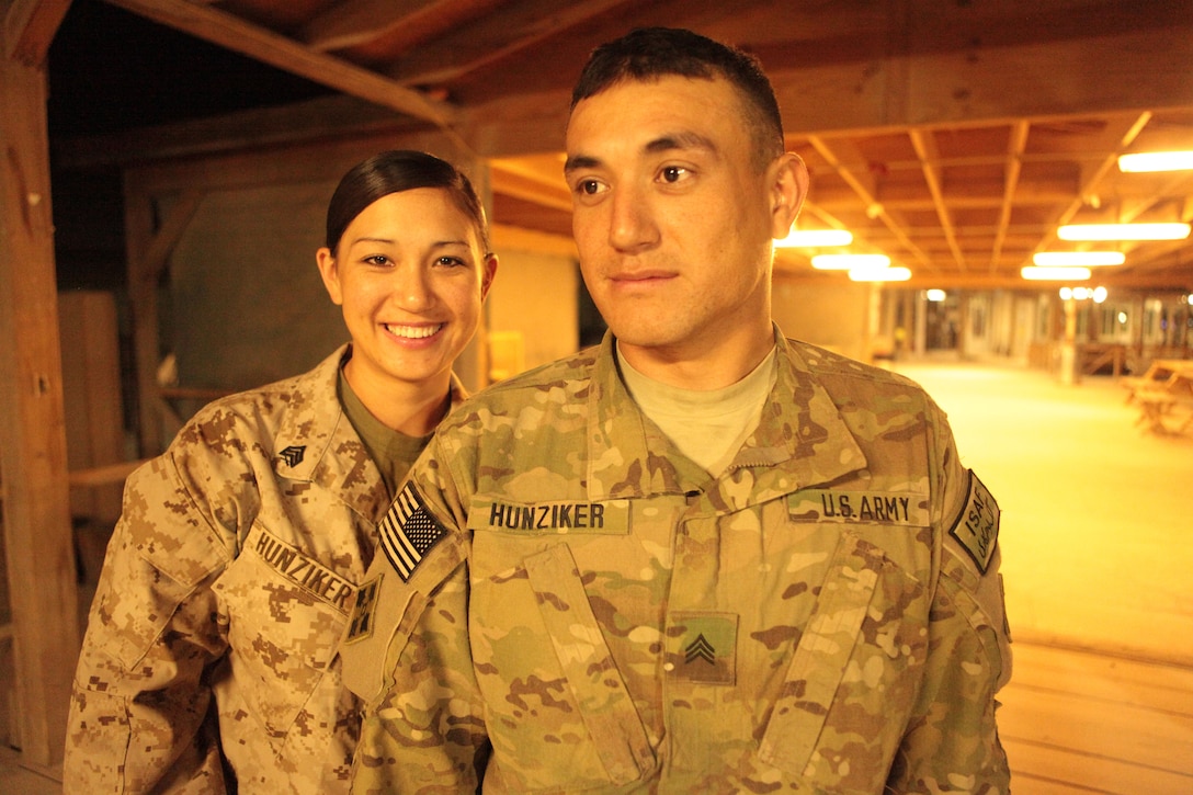 Sgt. Judy Hunziker, left, a maintenance administration clerk with Marine Attack Squadron 513, and her brother U.S. Army Sgt. George Hunziker, an infantryman with 2nd Brigade, 4th Infantry Division, stand together at the boardwalk in Kandahar Airfield, Afghanistan, June 1. The last time the two saw each other was on pre-deployment leave in Colorado Springs, Colo. The two were to meet at Kandahar a month and a half later. “I’ve always joked that if I saw my brother here, that I didn’t care who was in front of me, I’d push them out of my way,” she said. “It was overwhelming, seeing a face I saw every day growing up, in a country a world away. It felt like a piece of home.”
