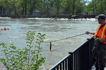 MINOT, N.D. –Zack Hillman, U.S. Geological Survey, hydrological technicians, measures the flow of water June 1 In preparation for possible flooding, as Airmen from Minot Air Force Base, North Dakota National Guard as well as many other organizations, are setting up secondary dikes along the river. The Souris River threatens to break the levies already in place, thousands of Minot citizens, including military members, their families and DoD civilians, have been forced to evacuate the area.  (U.S. Air Force photo/Senior Airman Jesse Lopez)