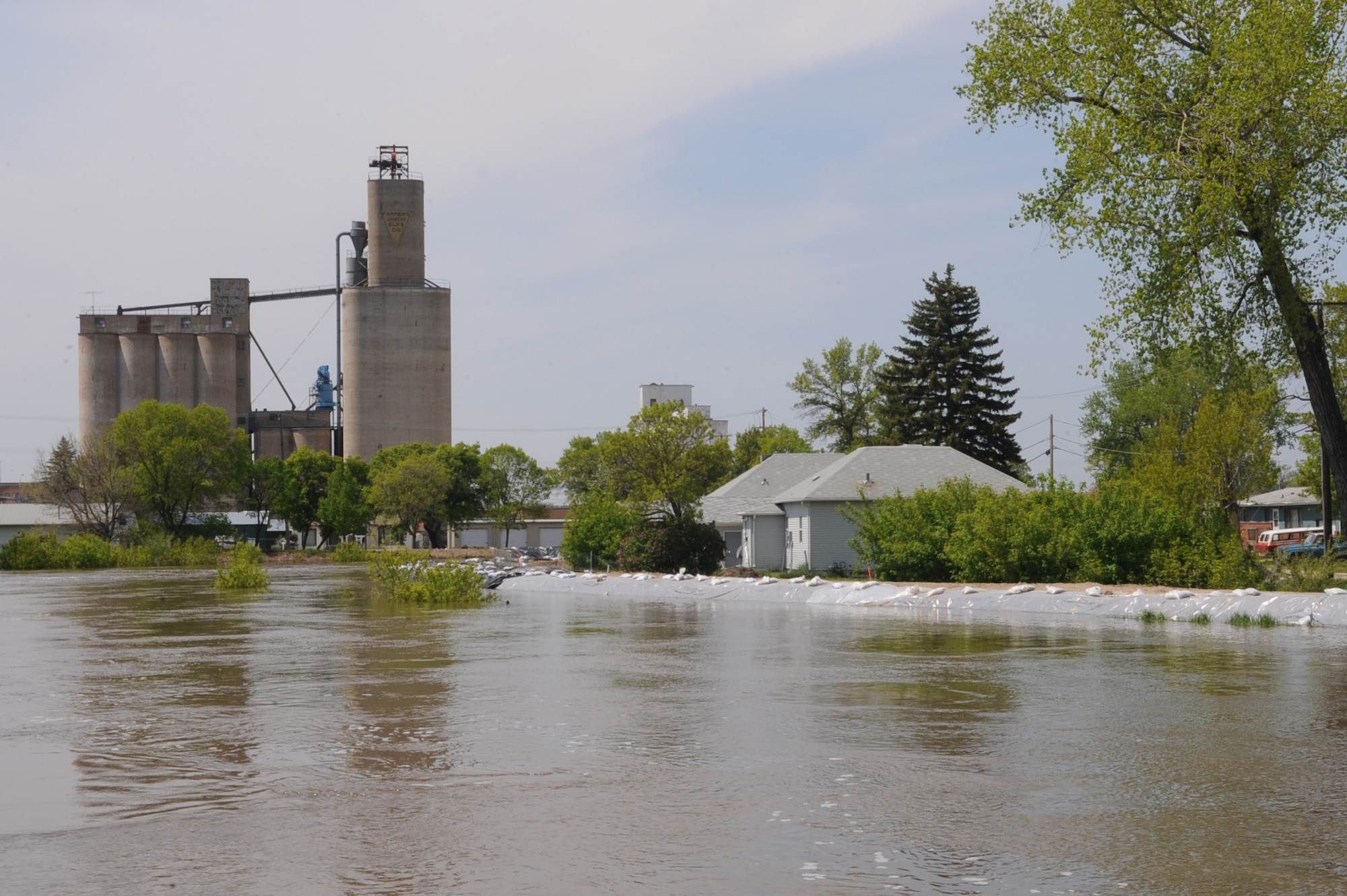 Water rises toward the top of the river bank June 1, 2011, along the Souris River in Minot, N.D. In preparation for possible flooding, local volunteers, with assistance from Airmen from Minot Air Force Base and the North Dakota National Guard, are setting up secondary dikes along the river. Because the Souris River threatens to break the levies already in place, thousands of Minot citizens, including military members, their families and DOD civilians, have been forced to evacuate the area. (U.S. Air Force photo/Airman 1st Class Aaron-Forrest Wainwright) 