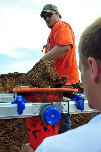 MINOT, N.D. -- Members of Team Minot work together to make sandbags at the Minot Public Works June 1 In preparation for possible flooding, the city of Minot, with assistance from Airmen from Minot Air Force Base, North Dakota National Guard as well as many other organizations, are setting up secondary dikes along the river. The Souris River threatens to break the levies already in place, thousands of Minot citizens, including military members, their families and DoD civilians, have been forced to evacuate the area.  (U.S. Air Force photo/Senior Airman Jesse Lopez)
