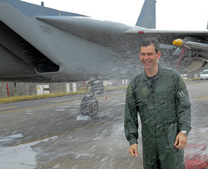 Brig. Gen. Ken Wilsbach, 18th Wing Commander, is hosed down after completing a “fini-flight” in an F-15 Eagle, June 1. General Wilsbach is preparing to leave Kadena and assume the position of Deputy Director for Operations, Headquarters United States Pacific Command, Camp H.M. Smith, Hawaii. (U.S. Air Force photo/Airman 1st Class Brooke P. Beers)