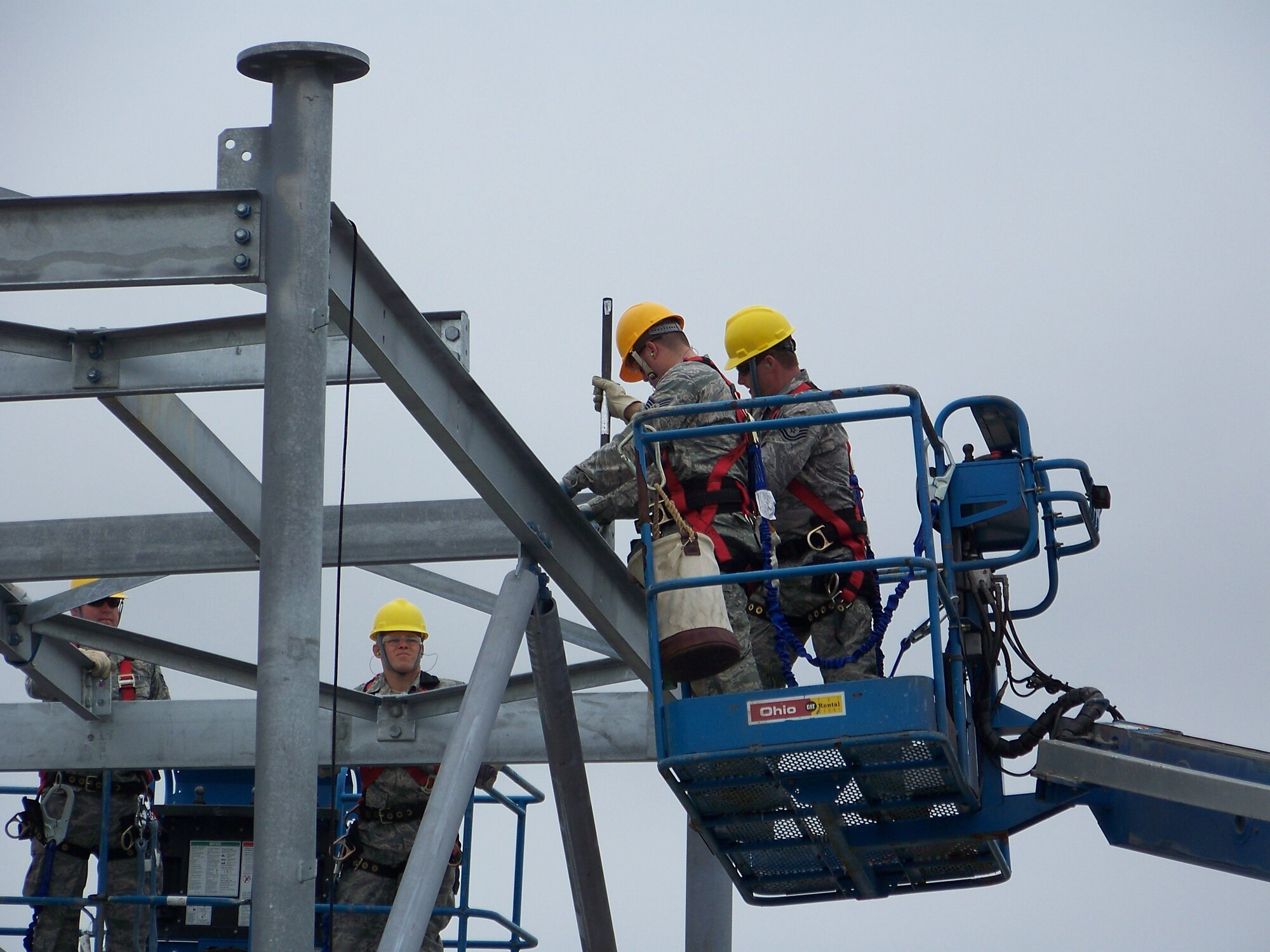 Airmen work on a 100' bi-static radar tower in early May 2011 at Springfield Air National Guard Base, Ohio. Air National Guard Airmen from engineering installation squadrons in six states helped construct four towers and install radar systems to provide the Air Force Research Laboratory at Wright-Patterson Air Force Base with the capability to conduct advanced sensors research. BRAC 2005 decisions directed relocation of the research radars to Wright-Patterson from Rome, N.Y.  (U.S. Air Force photo/Rick Shaughnessy)